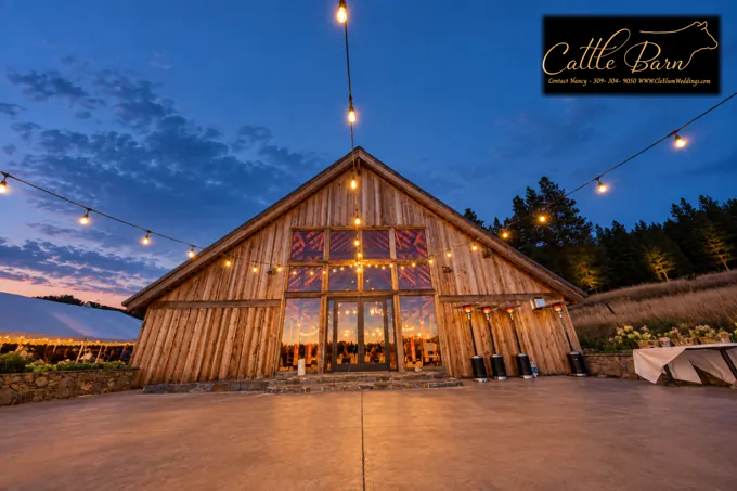 The Cattle Barn at dusk beneath strings of lights