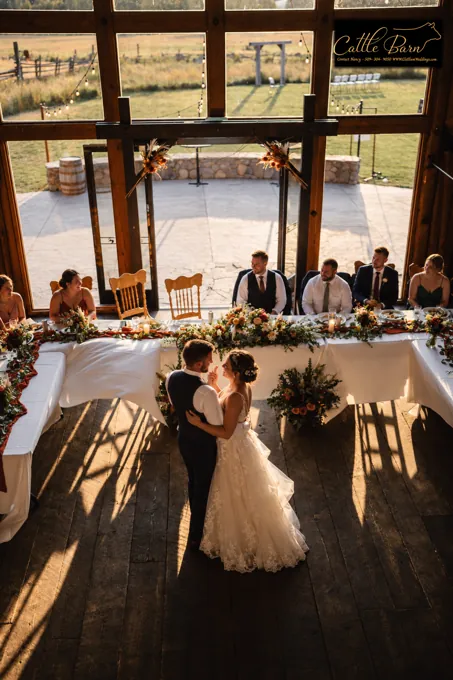 A couple’s first dance inside the barn